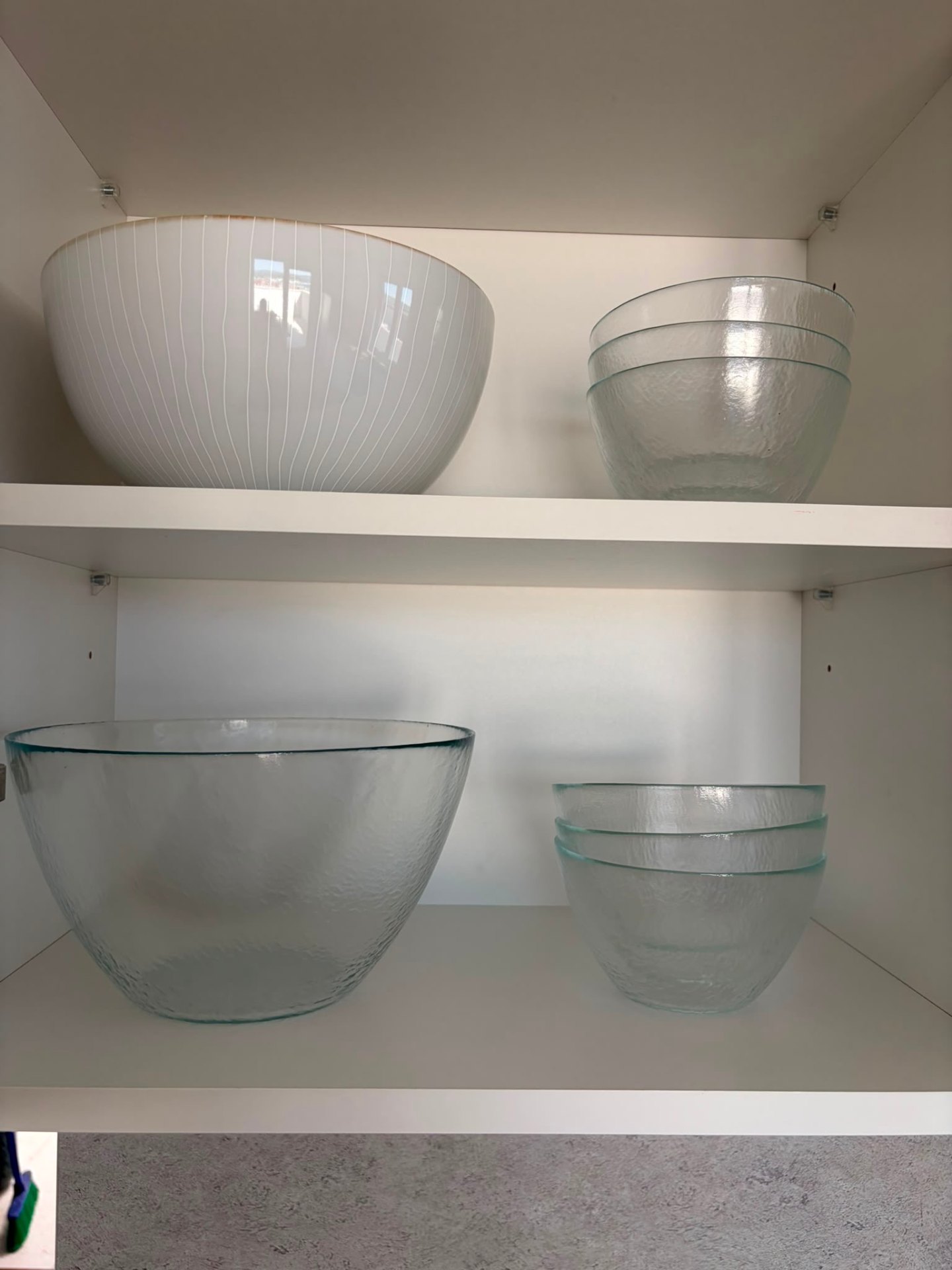 Glass bowls in the kitchen cabinet