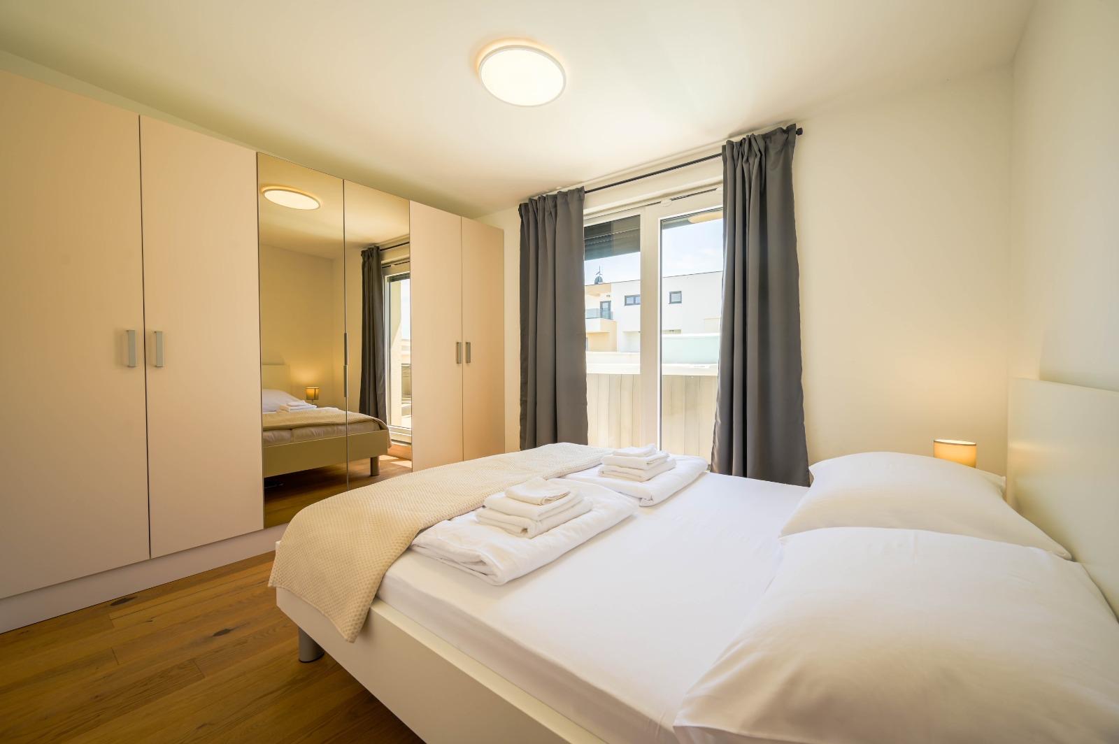 Bedroom with mirrored wardrobe