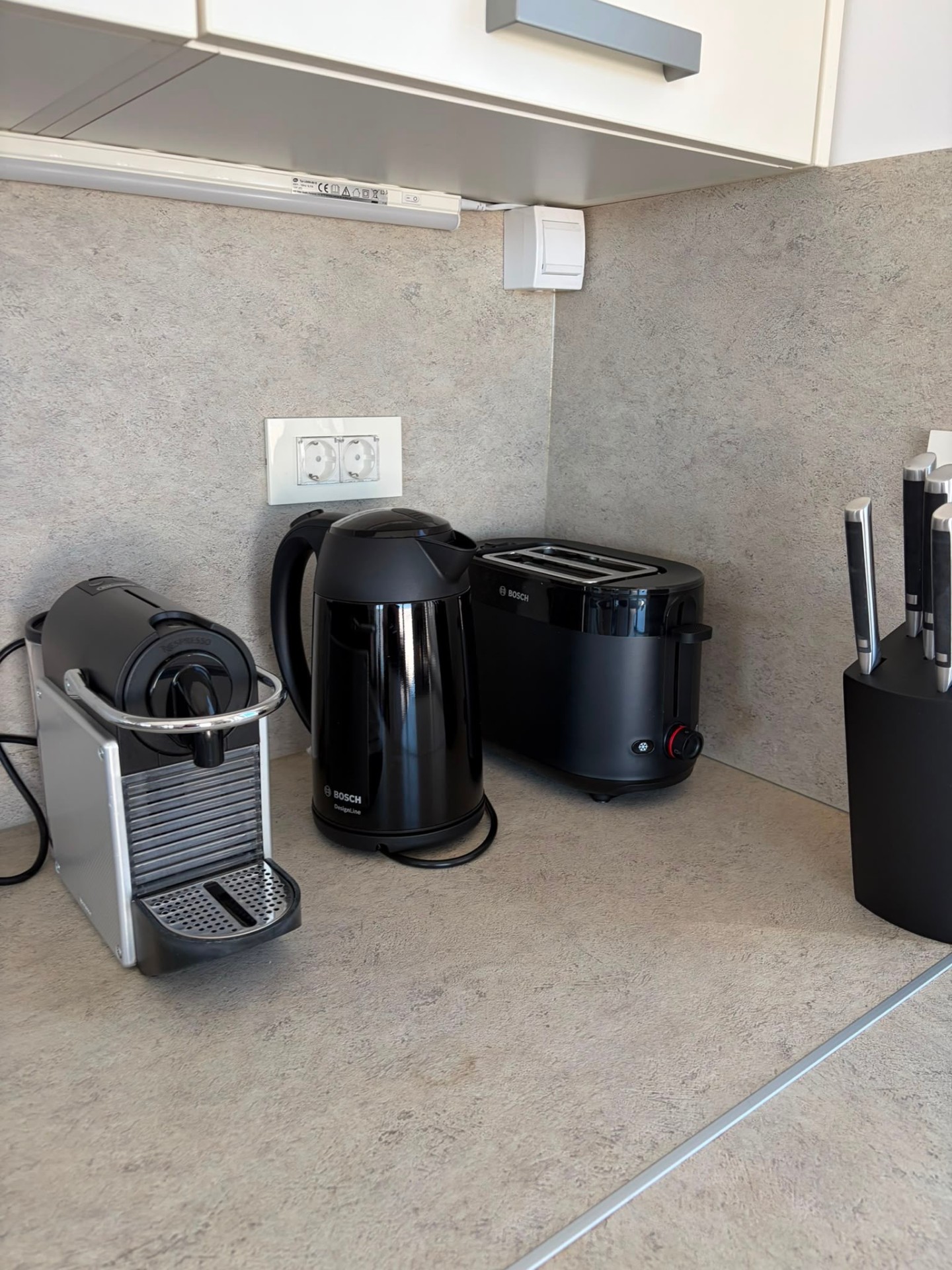 Nespresso, kettle and toaster on the counter