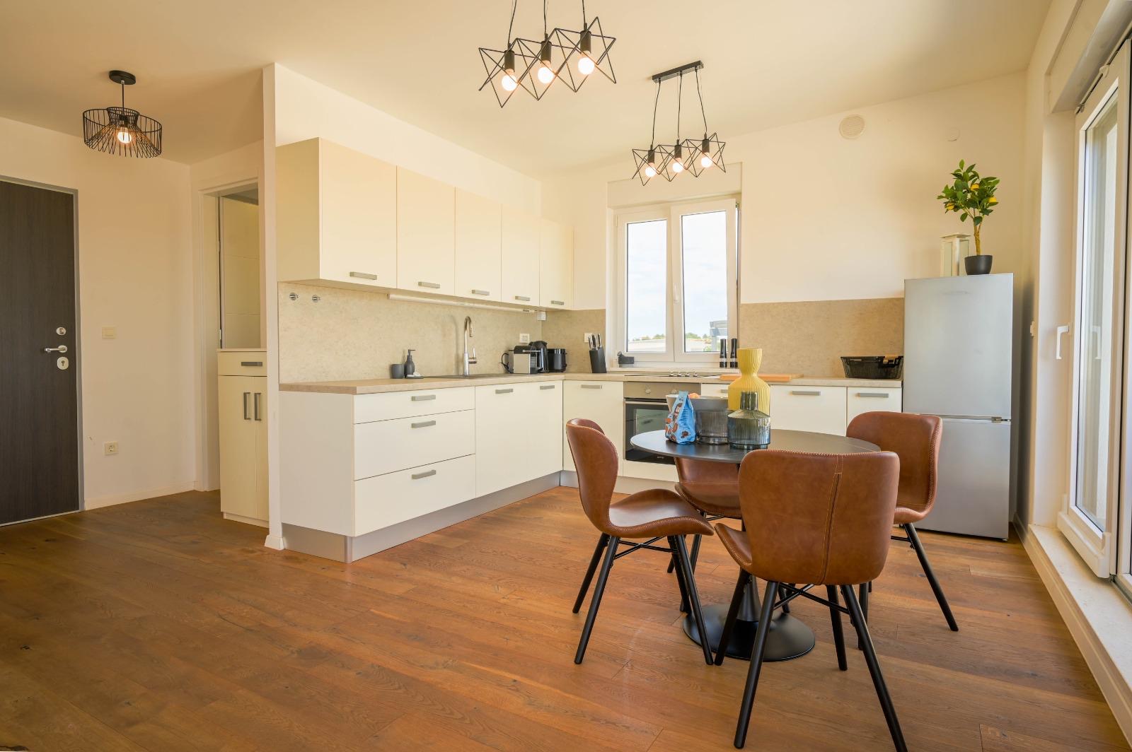 Kitchen and dining with geometric pendants