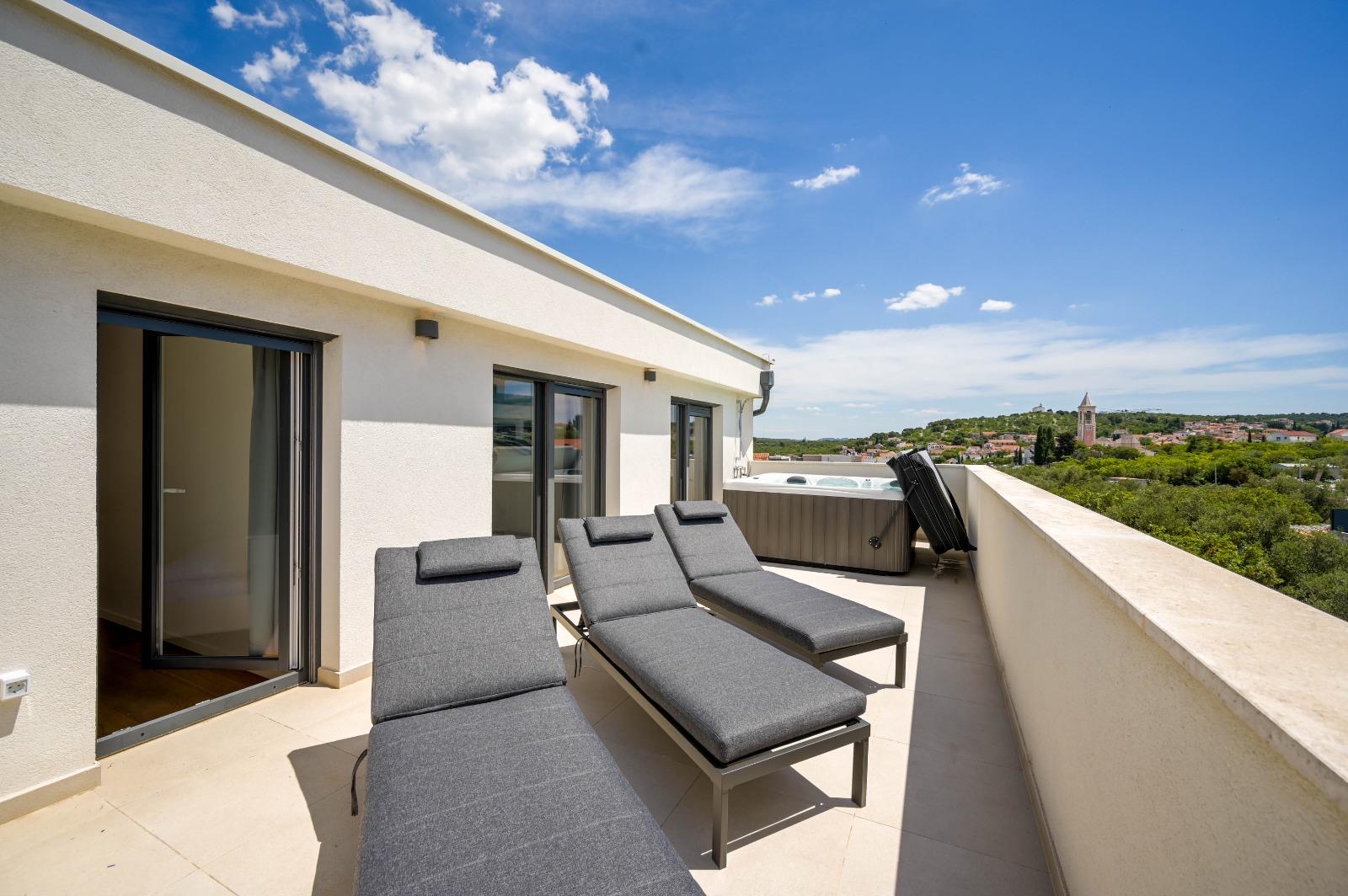 Sun loungers on the jacuzzi terrace