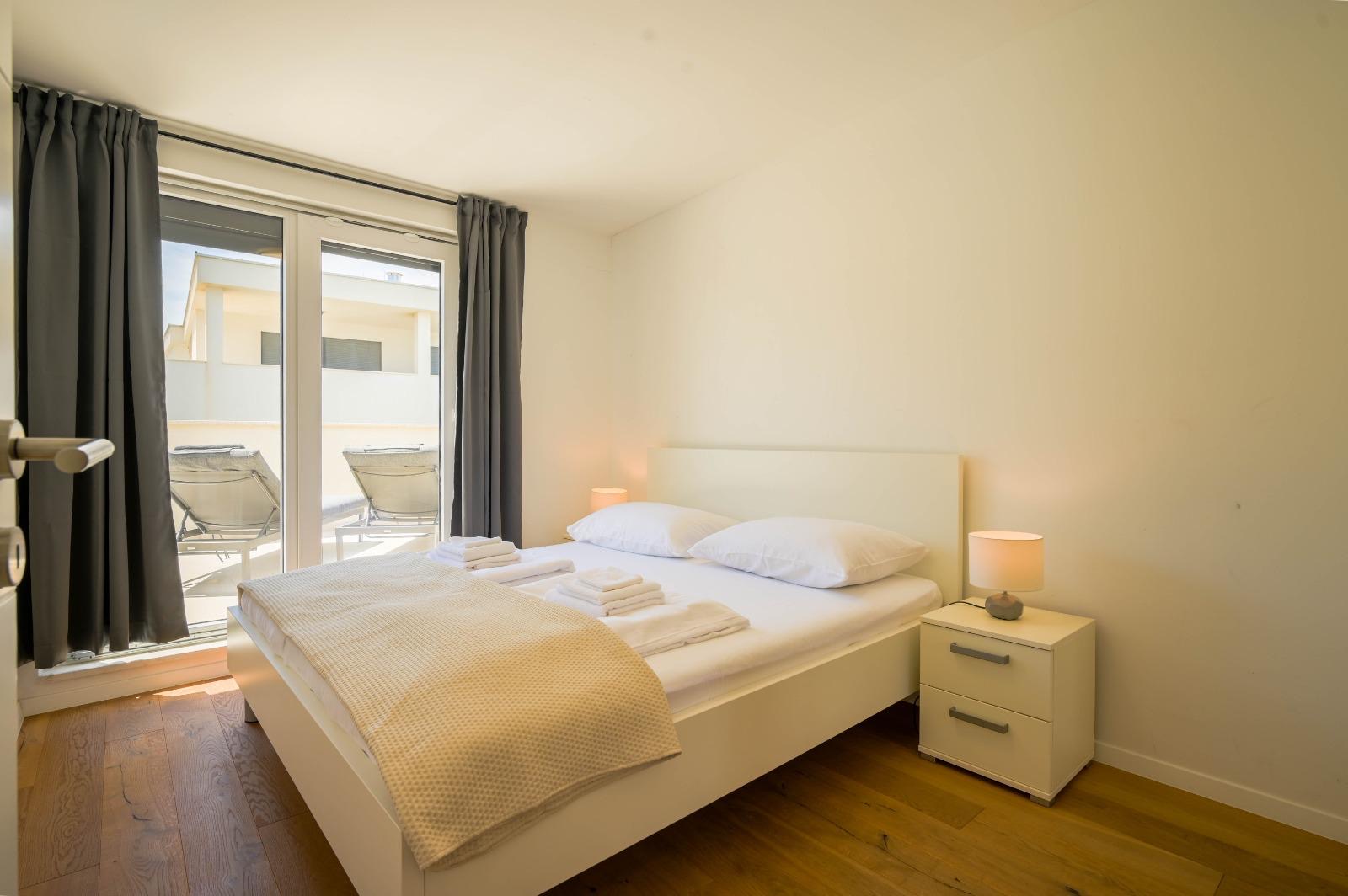 Bedroom with terrace beyond