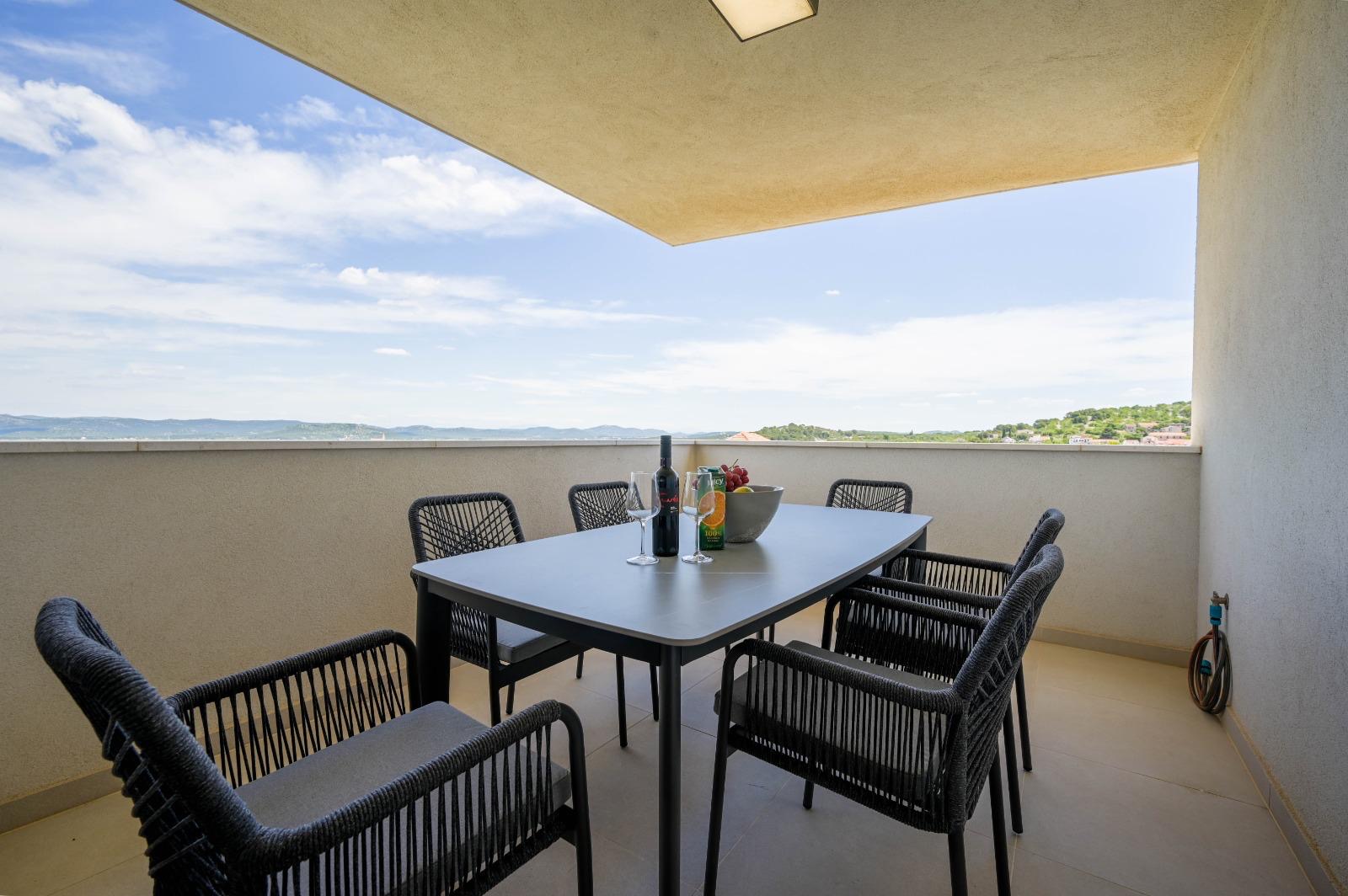 Table set for a meal on the covered terrace