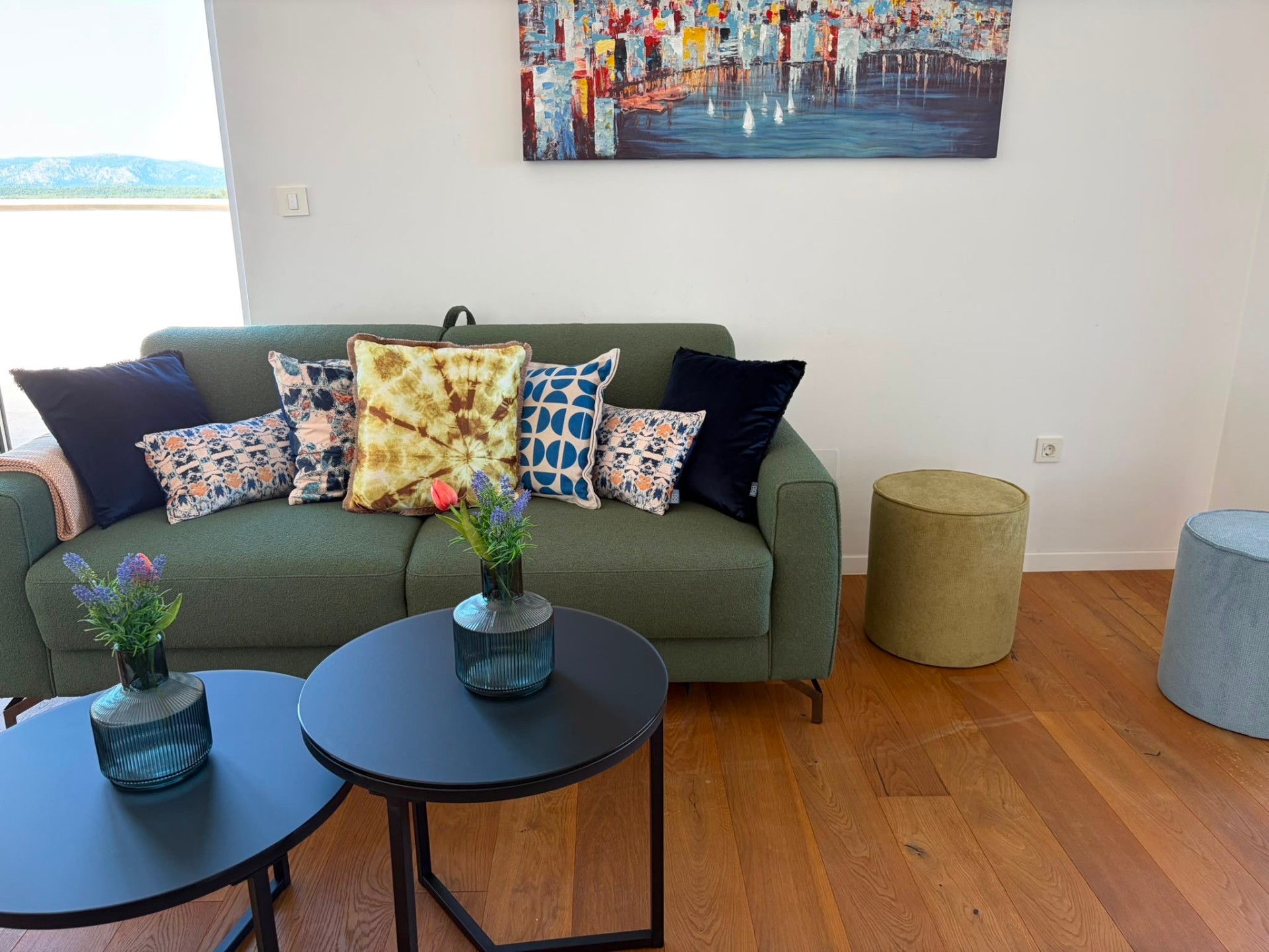 Sofa styled with cushions and flowers