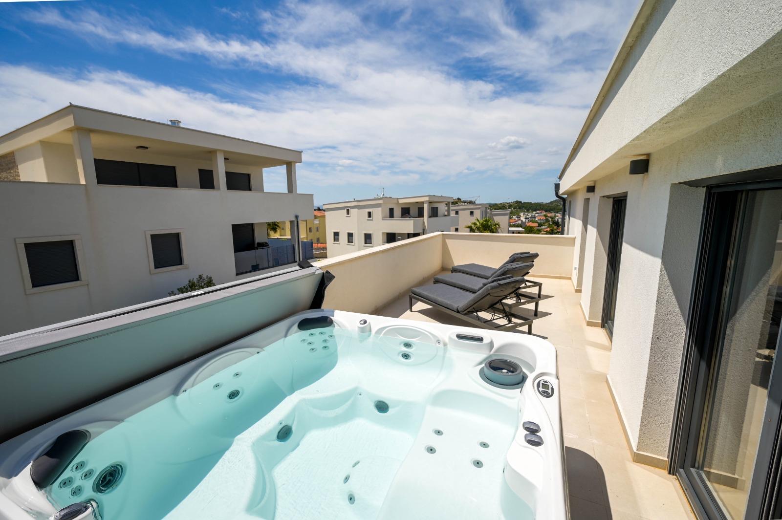Jacuzzi terrace with rooftop view